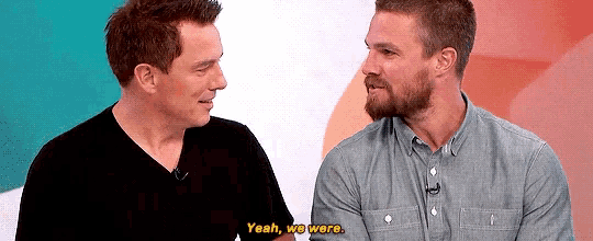 two men are sitting next to each other and one of them says yeah we were
