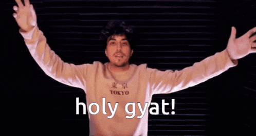 a man is wearing a tokyo sweatshirt and says holy gyat