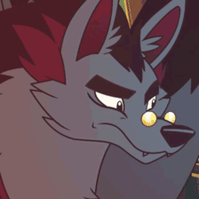 a close up of a cartoon wolf 's face with yellow eyes