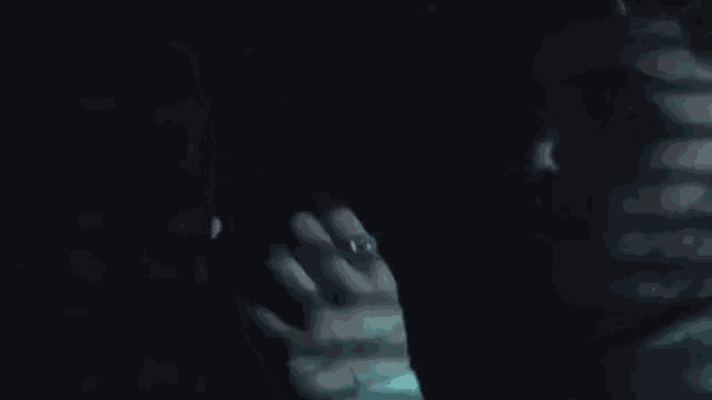 a close up of a person 's face with a shadow on it .