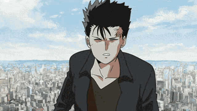 a man in a black jacket is standing in front of a city skyline
