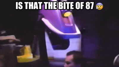 a man sitting in front of a roller coaster with the words is that the bite of 87 above him