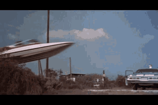 a boat is being towed by a car with a license plate that says ' police '