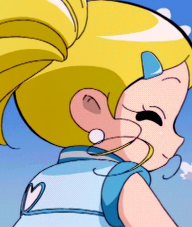 bubbles from the powerpuff girls is wearing a blue dress with a heart on the back