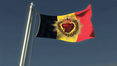 a flag with a heart and a cross on it is flying in the wind