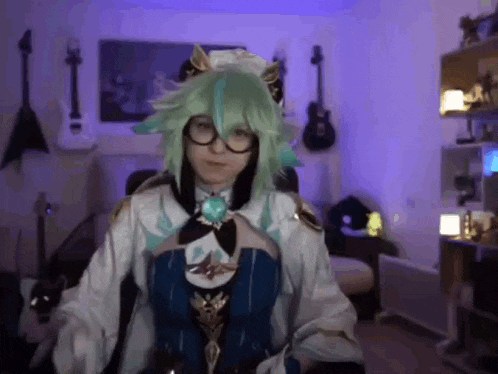 a woman in a green wig and glasses is standing in a room .