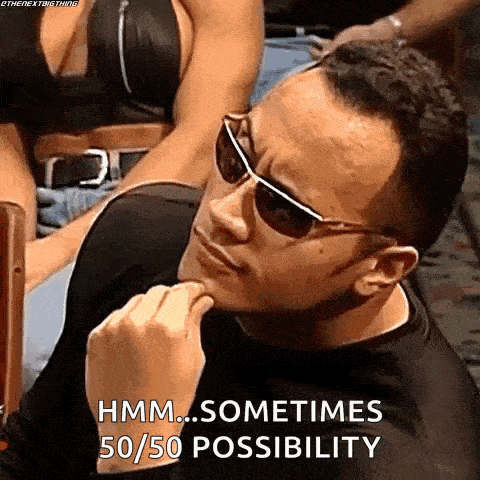 the rock is wearing sunglasses and making a funny face while sitting in a chair .