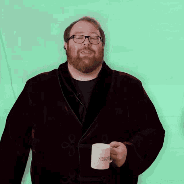 a man in a robe is holding a coffee mug that says ' christmas cookies ' on it