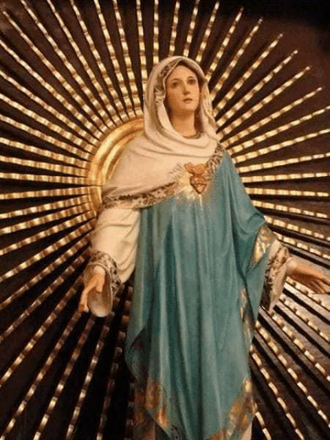 a painting of a woman in a blue robe with rays of light behind her .