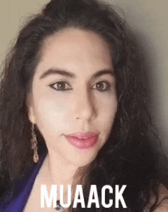 a close up of a woman 's face with the word muaack written on it