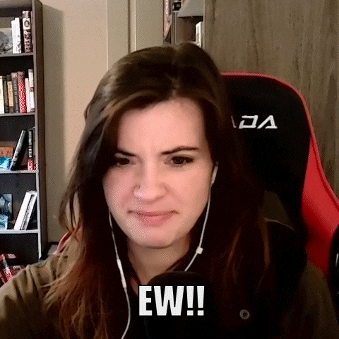 a woman wearing headphones is sitting in a chair with the word ew written on her face .