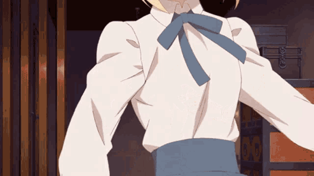 a woman in a white shirt with a blue bow on her neck