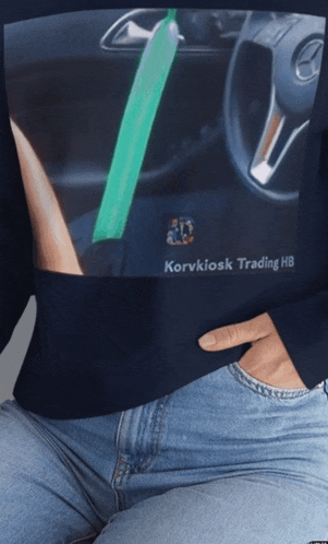 a woman wearing a sweater that says korvkiosk trading hb on it