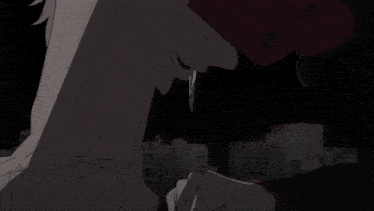 a close up of a person 's hand with sharp claws on the ground