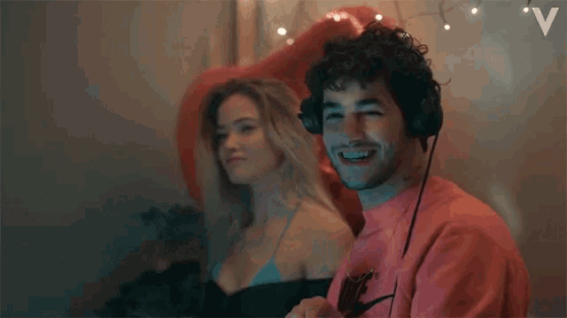a man and a woman are dancing together in a room .