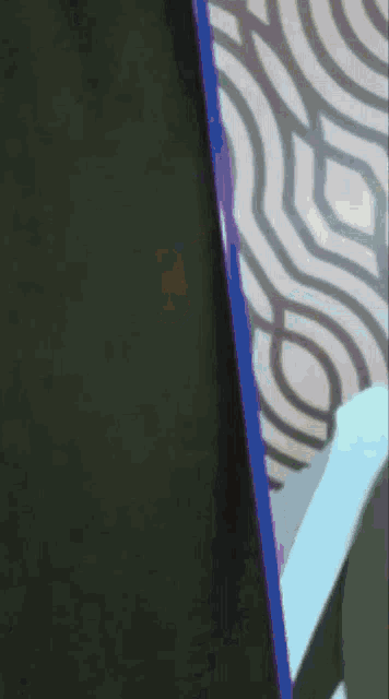 a close up of a painting with a blue border and a geometric pattern