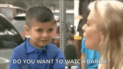 a little boy is talking to a woman in a blue shirt .