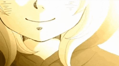 a close up of a person 's face with a slight smirk on their face