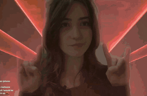 a woman 's face is shown in a blurry photo with a yellow background and the words " balloons " on the bottom right