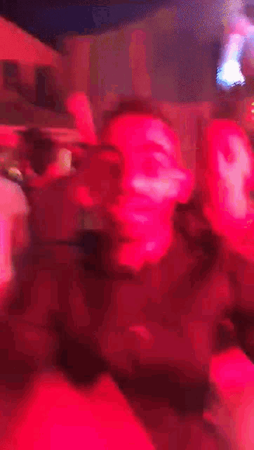 a man wearing a shirt that says ' adidas ' on it