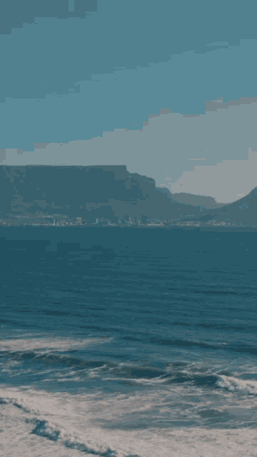 a poster for sab&dagi summer with a picture of the ocean and mountains in the background