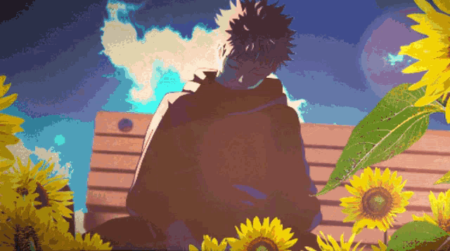 a man sitting on a bench with sunflowers in the foreground