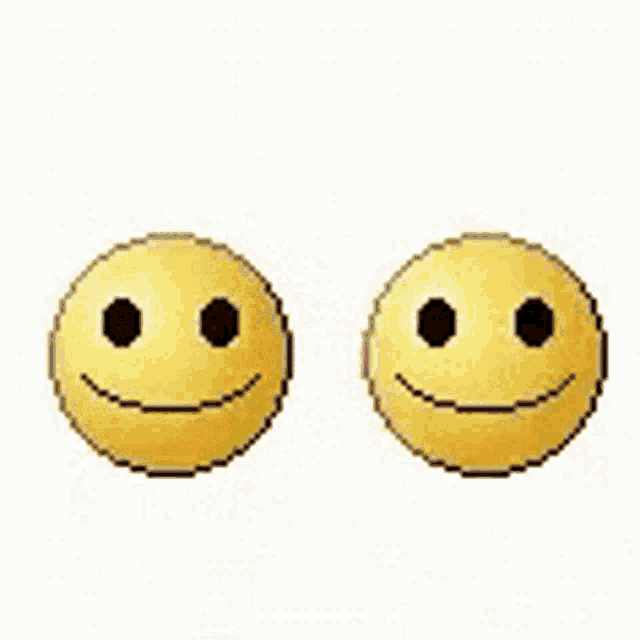 two yellow smiley faces are kissing each other with red hearts in the background .