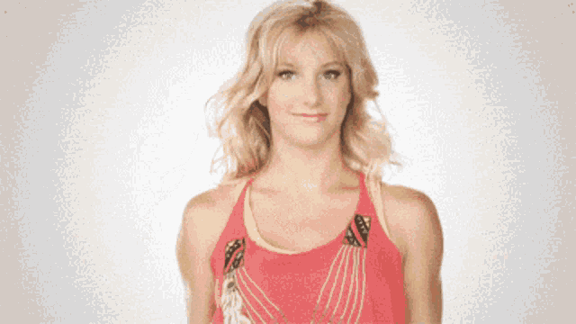 a woman in a red tank top with a yellow stripe on the side