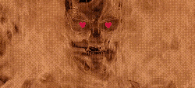 a skull with red hearts in its eyes is surrounded by fire .