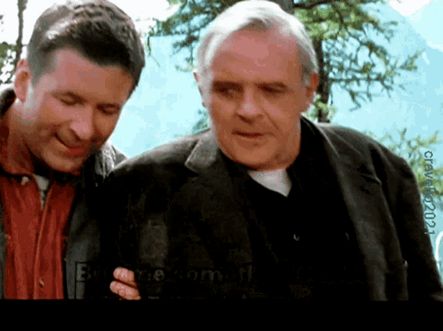two men are standing next to each other with a watermark that says ' become.com.tf ' on it