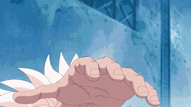a pixelated image of a person 's hand reaching out