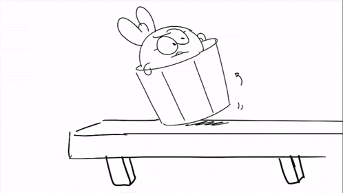 a black and white drawing of a rabbit sitting in a bucket .