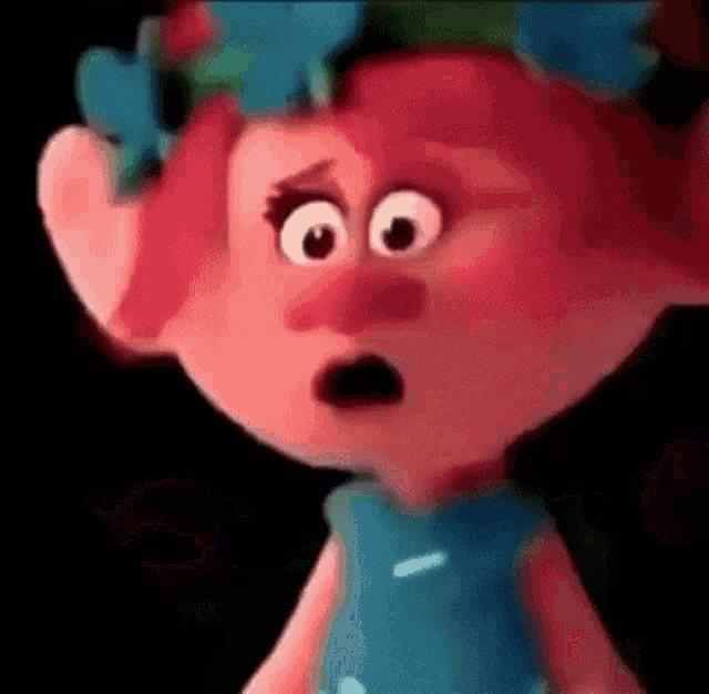 poppy from trolls is wearing a blue dress and a flower crown .