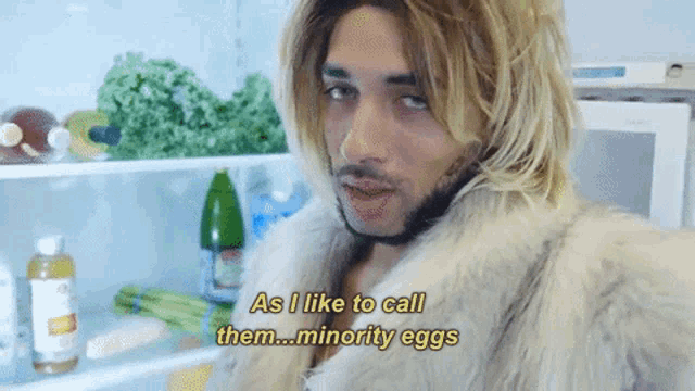 a man in a fur coat says " as i like to call them minority eggs " in front of a refrigerator
