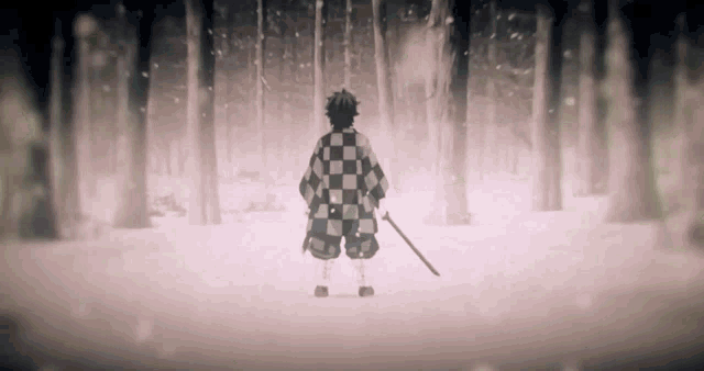a man in a checkered shirt holds a sword in the snow