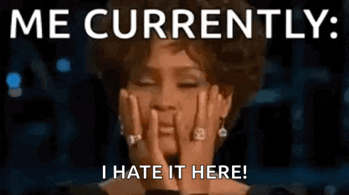 a woman is covering her face with her hands and the words `` me currently , i hate it here '' .