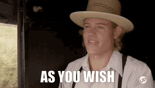a man wearing a straw hat says " as you wish "