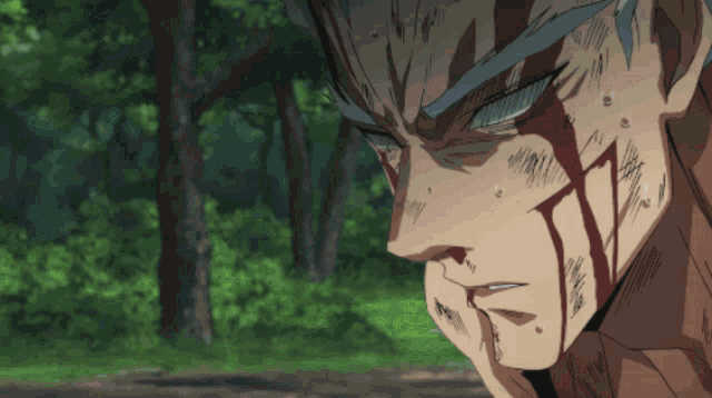 a close up of a man 's face with blood coming out of his mouth