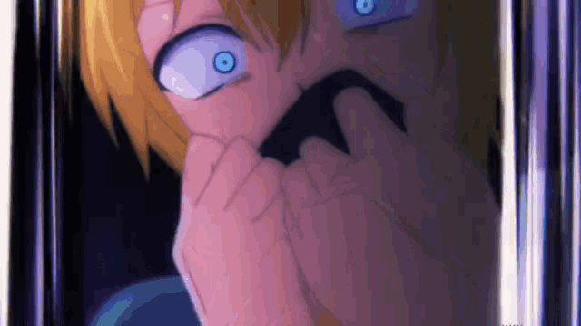 a close up of a person 's face with blue eyes and a black mouth .