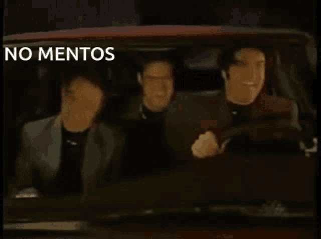 three men are driving a car with the words no mentos written above them