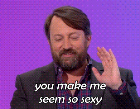 a man in a suit and plaid shirt is saying you make me seem so sexy .