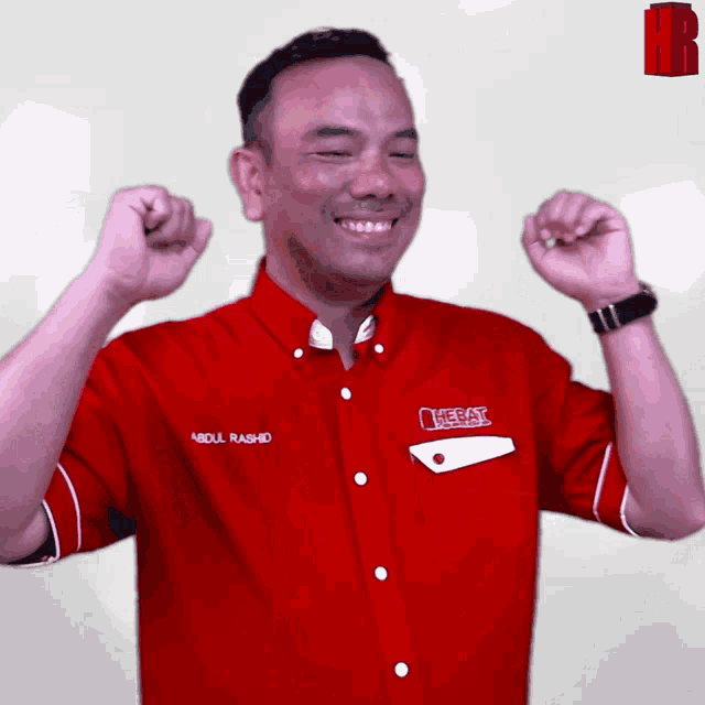 a man in a red shirt that says abdul rashid