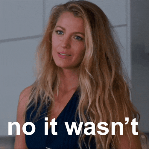 a woman with long blonde hair has the words no it wasn 't on her face