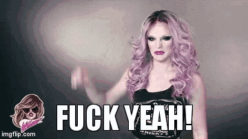 a drag queen with purple hair is saying fuck yeah !