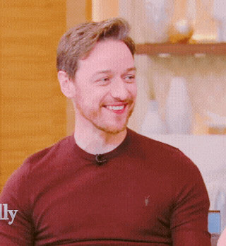 a man wearing a maroon sweater with the word ly on it