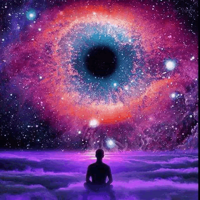 a man is sitting in a lotus position in front of a huge eye in the sky .