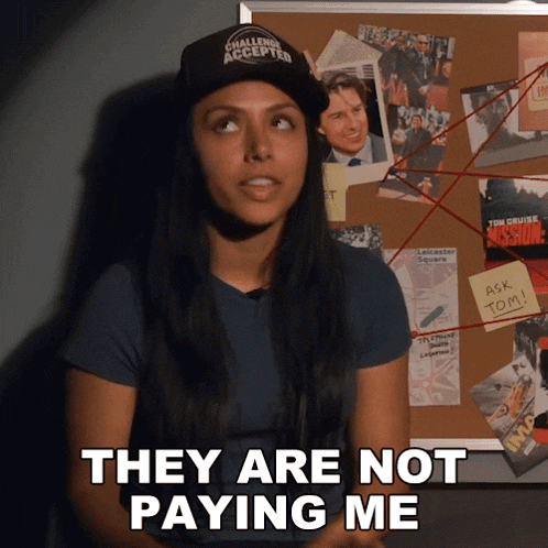a woman says they are not paying me in front of a bulletin board