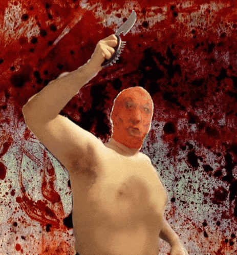 a shirtless man with a red mask holding a knife