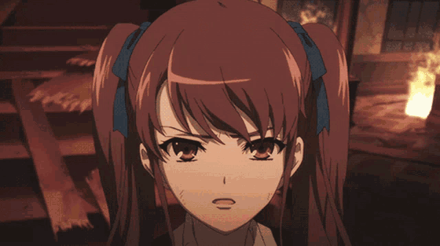 a close up of a girl with red hair and a blue bow
