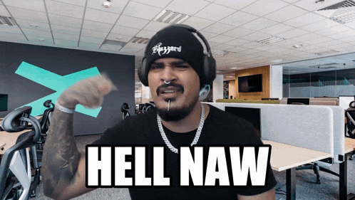 a man wearing headphones and a beanie is saying hell naw